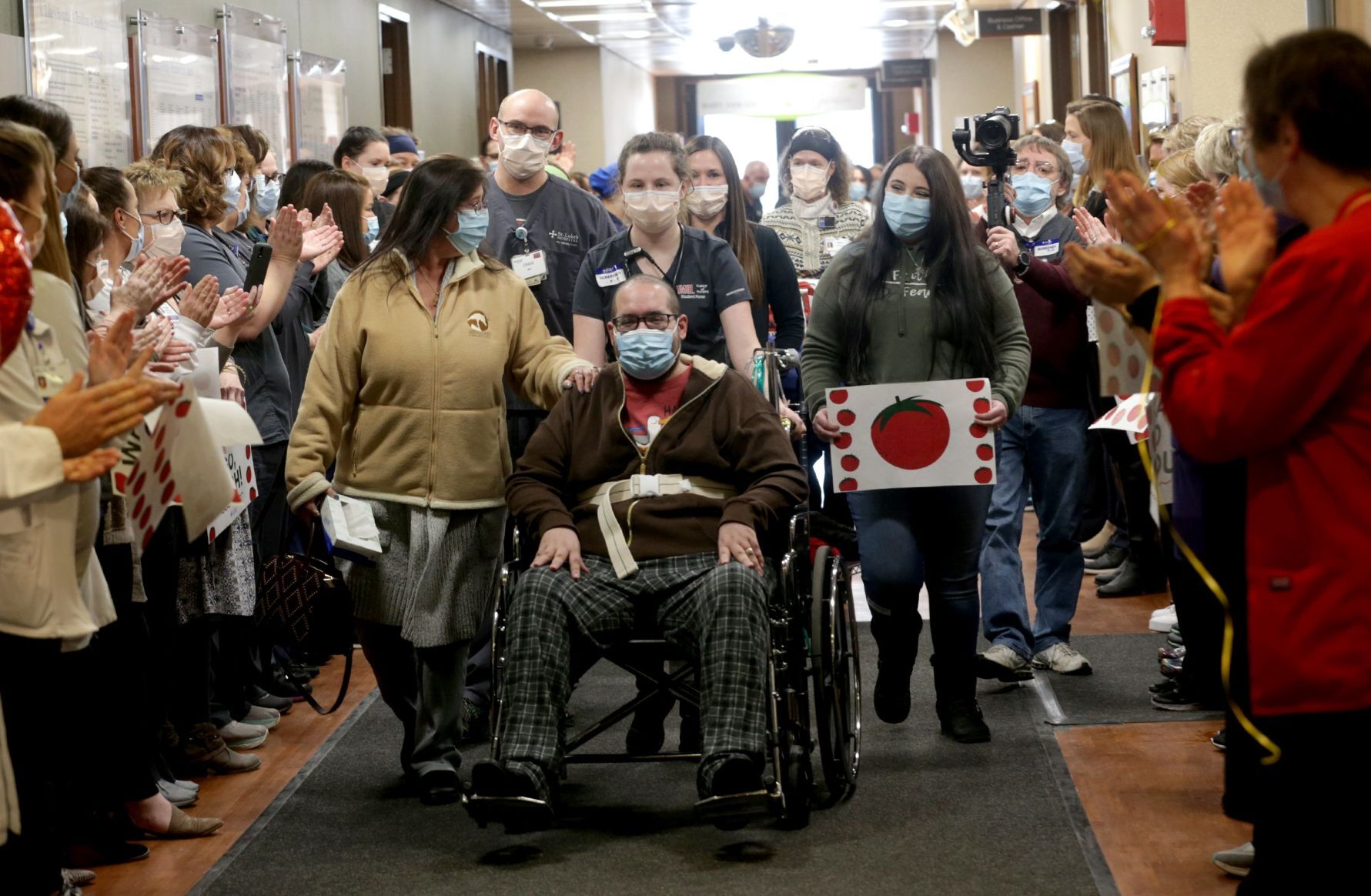 Staff cheers as COVID-19 survivor Joshua Miller discharged from St. Luke's Hospital
